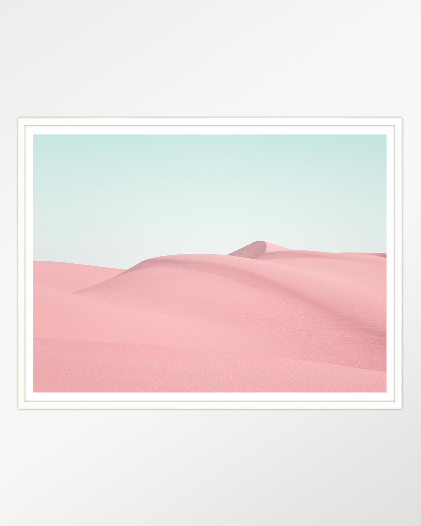 Pink serenity: Desert dunes at dawn